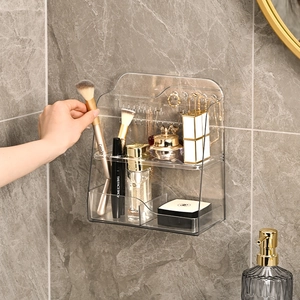 Wall-mounted clear PET makeup organizer with brush slots on marble wall
