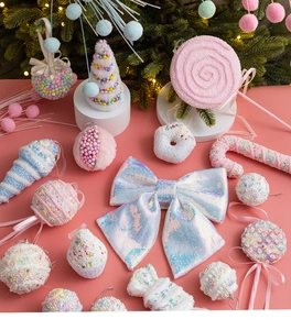 Detail view of pink macaron style Christmas ornaments with sequins and foam textures
