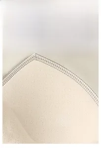 Close-up of seamless yoga top featuring breathable mesh texture and built-in bra pads