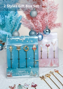 Detailed close-up of stainless steel Christmas dessert spoons with cute cartoon charms