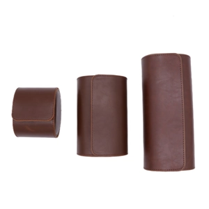 Three sizes of brown leather watch storage rolls with stitching on white background