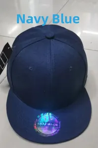 Navy blue flat brim snapback hat showing the holographic sticker and twill cotton crown