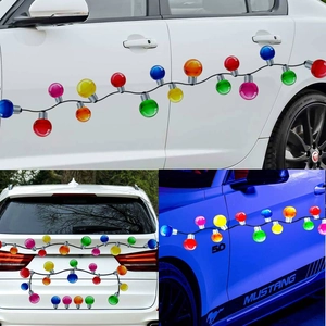 Macro shot of colorful bulb-shaped magnetic car stickers on white and blue car surfaces