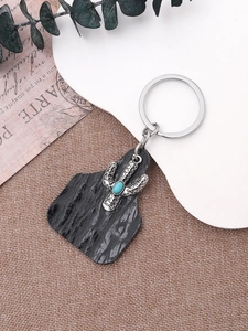 Bohemian cactus keychain detail with grey leather and turquoise stone accent
