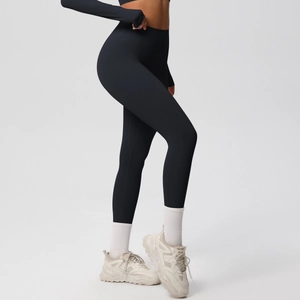 Detail of black high-waisted yoga leggings with moisture-wicking fabric and squat-proof fit