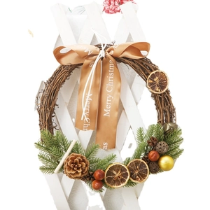 Christmas wreath with pine cones and berries on a twig vine base for door decor
