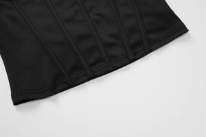 Close-up of high-quality stitching and seam structure on a black slim fit corset top