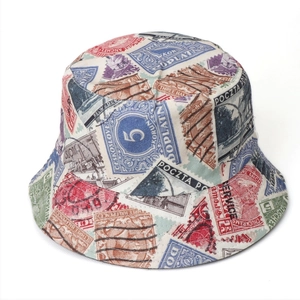 Close-up of vintage stamp print detail on a reversible cotton bucket hat crown