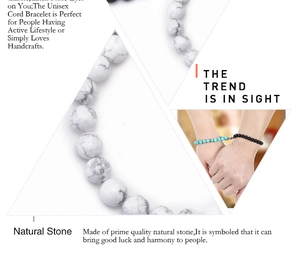 Detail of natural stone magnetic bracelets showing marble and turquoise beads on wrist