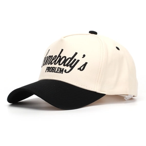 Close-up of embroidered Somebody's PROBLEM text on two-tone cotton baseball cap