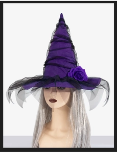 Close-up of purple Halloween witch hat with black mesh veil and rose detail on silver hair