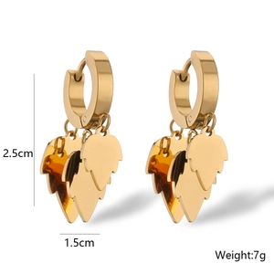 Close-up of gold-plated leaf earrings with dimensions 2.5x1.5cm weighing 7g
