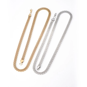 French vintage flat woven gold and silver chain necklace on white background