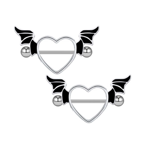Detailed view of heart shaped nipple rings with black wing accents on white background