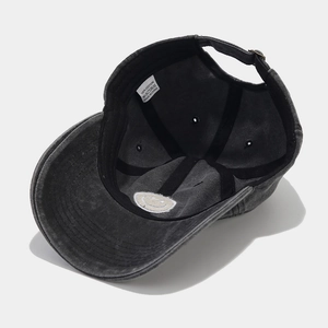 Charcoal washed cotton baseball cap with embroidered smiley face and metal buckle