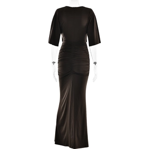 Detail of the elegant ruched back design and slim fit on a long dark brown dress