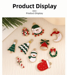 Detail of diverse Christmas enamel pendants including Santa and Xmas tree for DIY jewelry