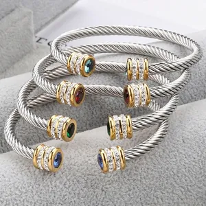 Twisted cable stainless steel cuff bangle with crystal set stones in gold and silver