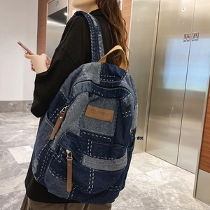 Retro denim patchwork backpack for students with large capacity and stylish blue fabric