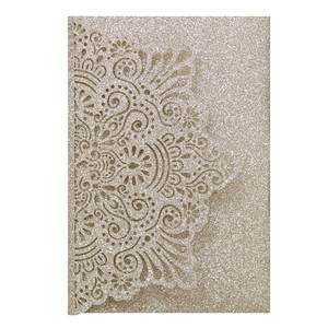 Detailed laser-cut mandala lace invitation sleeve made of glittery champagne gold paper