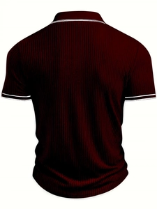 Detail of burgundy polo shirt featuring vertical knit texture and white contrast stripes
