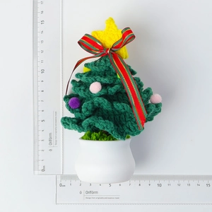 Handmade crochet mini Christmas tree potted plant decor with star and colorful pom-poms