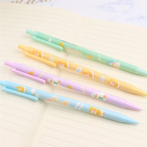 Close-up of four colorful cartoon duck mechanical pencils on a marble table notebook