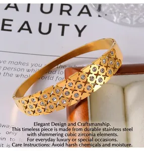 Macro shot of gold-plated hollow geometric bracelet with micro-pave cubic zirconia