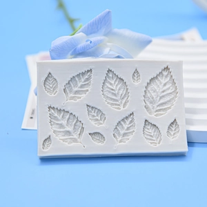 White silicone leaf texture mold for fondant and cake decoration on blue background