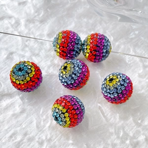 Close-up of colorful sparkling pavé crystal disco ball beads for DIY jewelry making