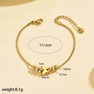 Vue détaillée du bracelet papillon doré montrant les dimensions et l'acier inoxydable