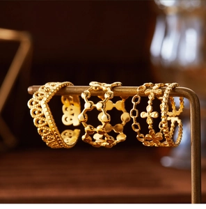 Detail of three-layer open hollow flower rings in 18K gold-plated stainless steel