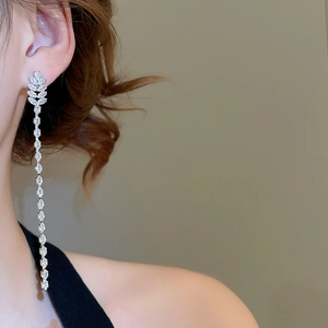 Macro view of 18K gold plated silver earrings with tassel cubic zirconia chain style