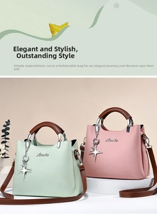 Detail of mint green and pink satchel bags with lychee grain texture and star charms