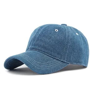 Classic dark blue denim baseball cap with contrast white stitching and a soft top