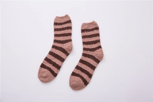 Close-up of soft brown striped coral fleece crew socks for men with plush texture