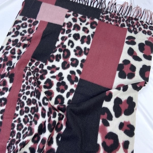Leopard print tassel scarf with burgundy color block and soft cashmere-like texture