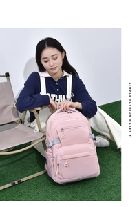Detailed side view of a light pink backpack featuring adjustable grey straps and buckles