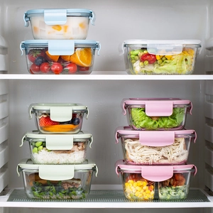 Set of 8 microwave-safe glass lunch boxes with colorful lids stored in a refrigerator