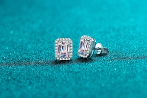 Macro shot of S925 silver stud earrings featuring radiant emerald cut moissanite stones