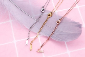 Detail of lobster clasp and adjustable chain in silver, gold, and rose gold stainless steel