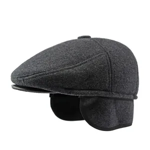 Men's wool winter flat cap in charcoal grey with warm ear flaps and sleek design