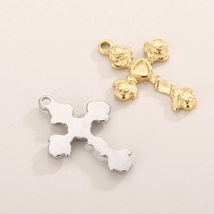 Gold and silver stainless steel cross pendants with rose design on textured surface