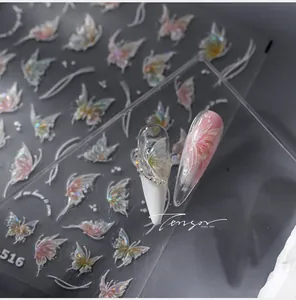 Macro detail of aurora butterfly nail art stickers with embossed 3D texture and iridescence