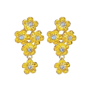 Elegant gold flower drop earrings with zircon centers in a sophisticated floral design