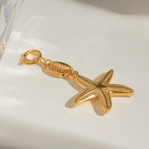 Golden starfish pendant with shell connector and spring clasp in stainless steel finish