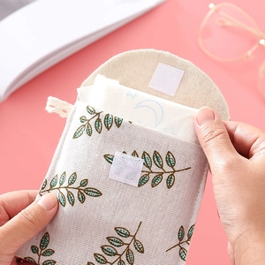 Cute cotton linen sanitary napkin storage bag with brown leaf patterns and velcro closure