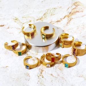 Set of gold stainless steel open rings featuring colorful birthstones and ribbed bands