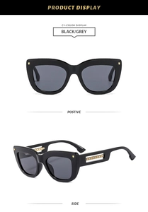 Detail view of black square cat eye sunglasses with decorative gold chain temples