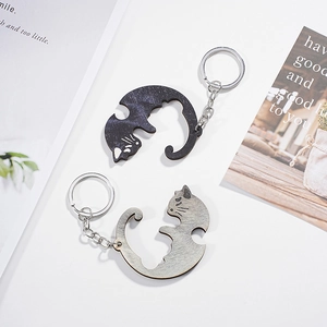 Interlocking wooden cat keychains for couples in natural wood and black finish